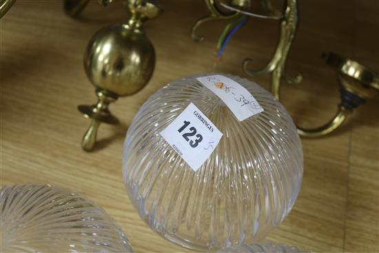 A ceiling light with glass shade